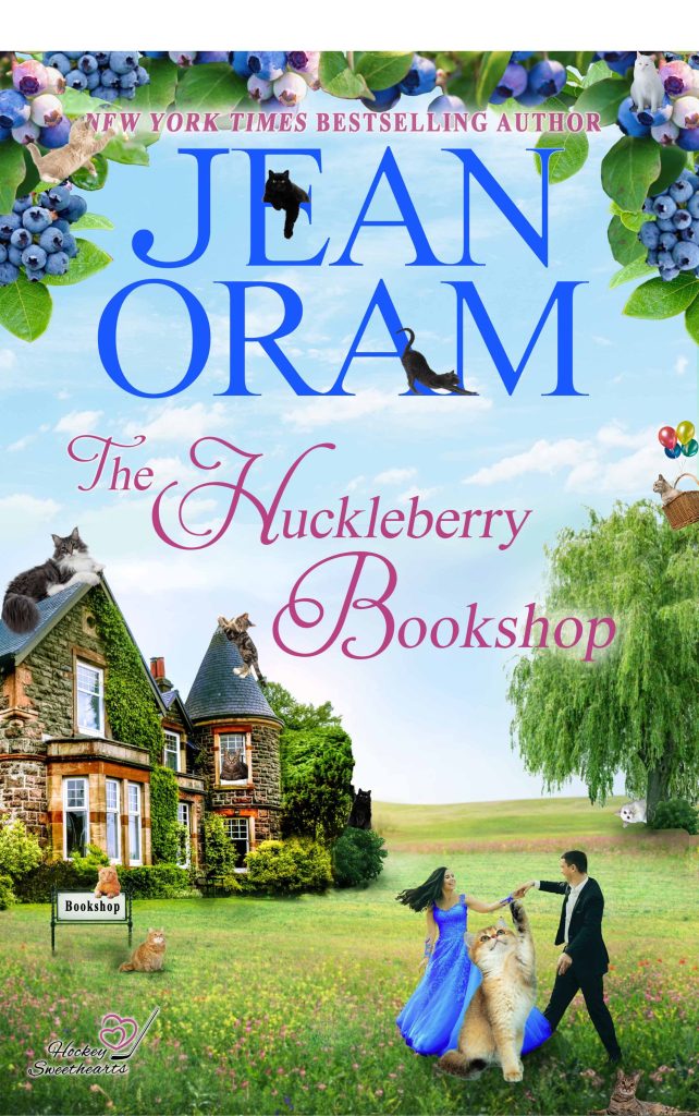 Find the extra cats hidden in the cover of The Huckleberry Bookshop by Jean Oram